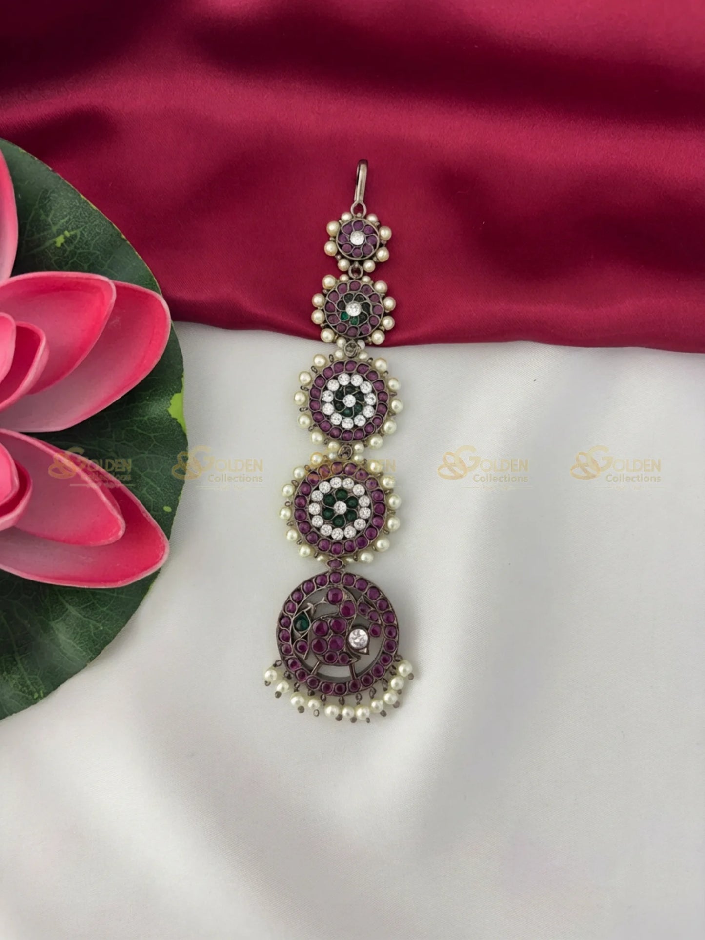 Golden Collections Black Kemp Maang Tikka - Detailed view highlighting the intricate stone setting and pearl hangings on the largest circular motif.