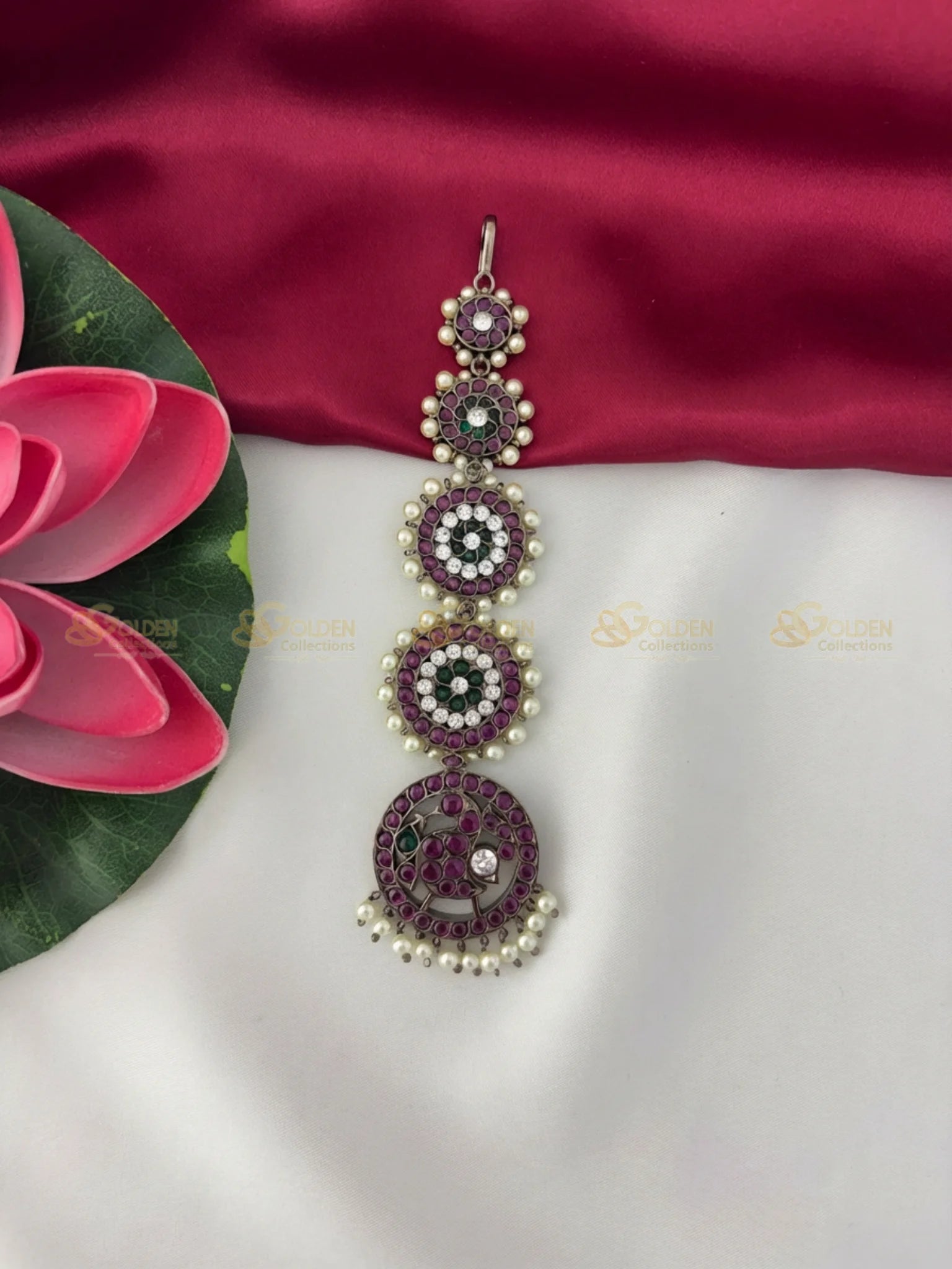 Golden Collections Black Kemp Maang Tikka - Detailed view highlighting the intricate stone setting and pearl hangings on the largest circular motif.