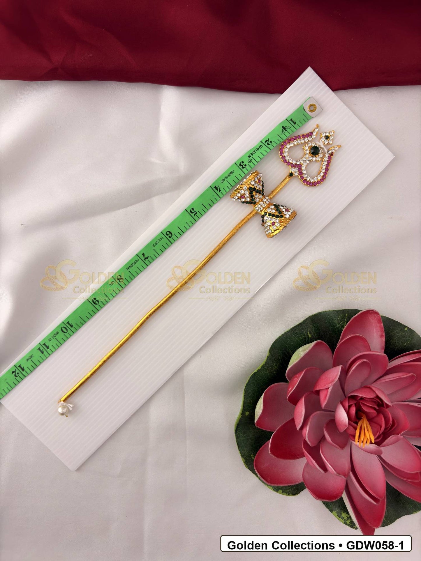 Measurement photo showing 12 Inches trishul with damaru for idol alankaram with measuring tape for idol alankaram