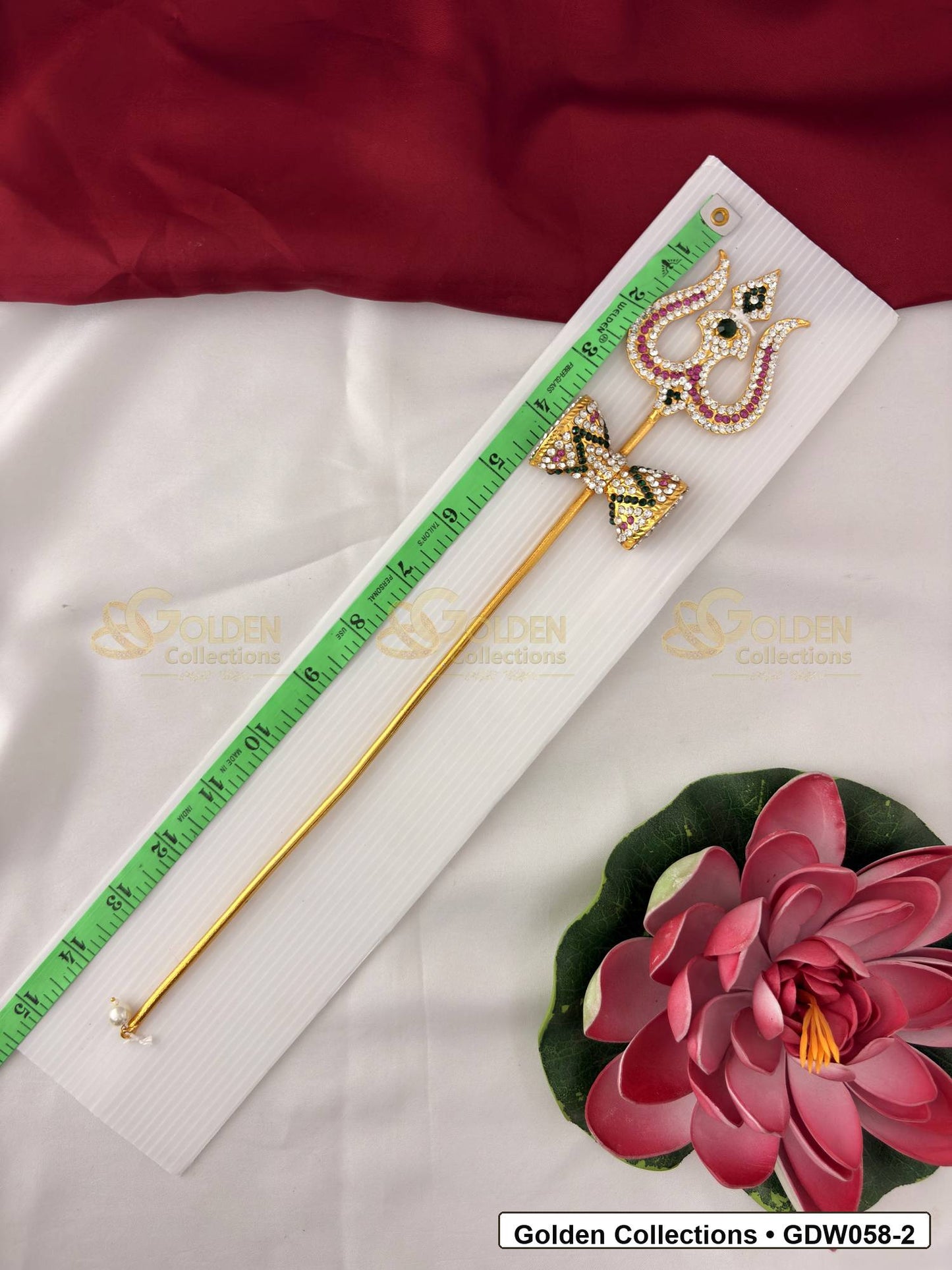 Measurement photo showing 14 Inches trishul with damaru for idol alankaram with measuring tape for idol alankaram