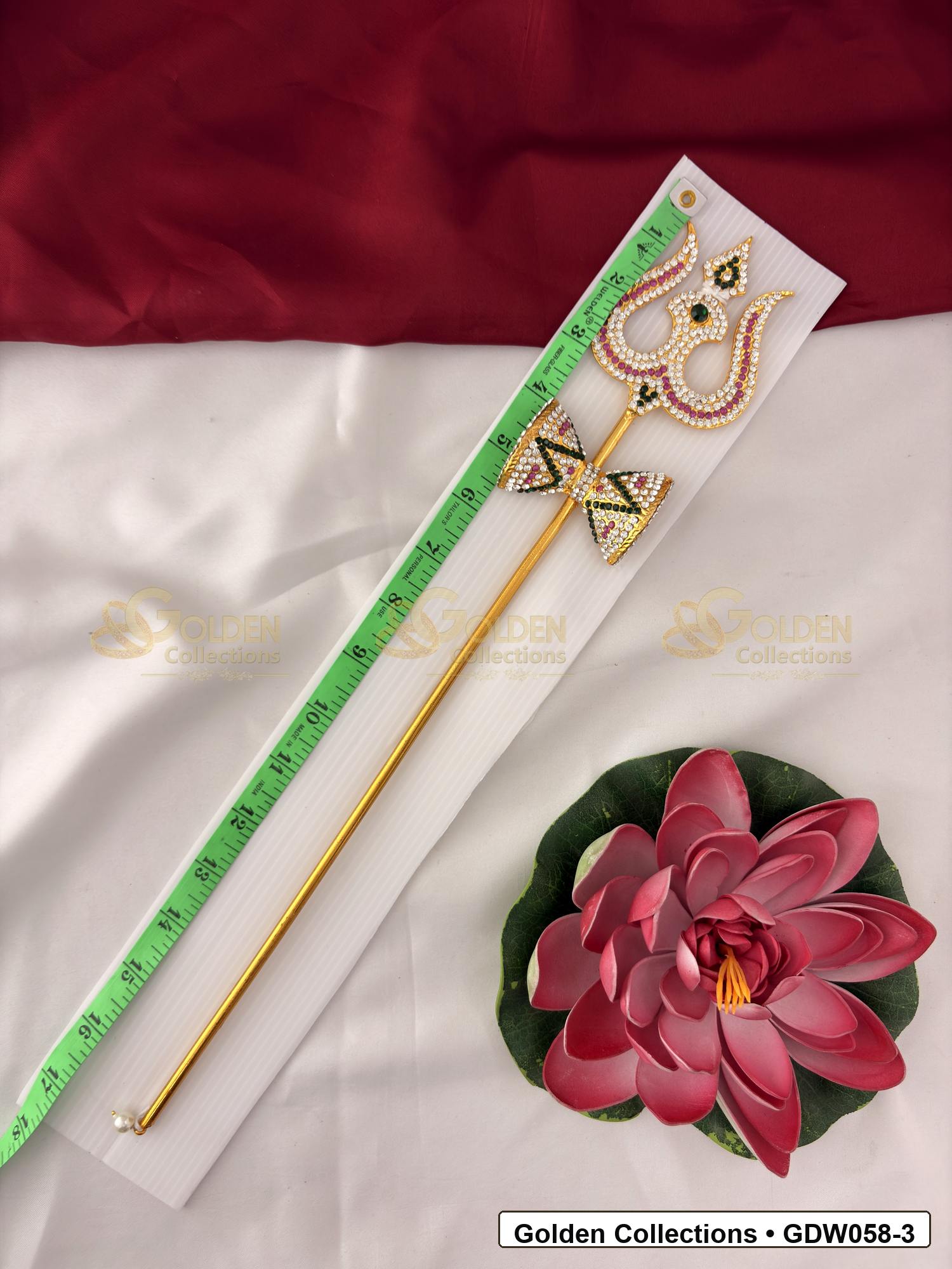 Measurement photo showing 17 Inches trishul with damaru for idol alankaram with measuring tape for idol alankaram