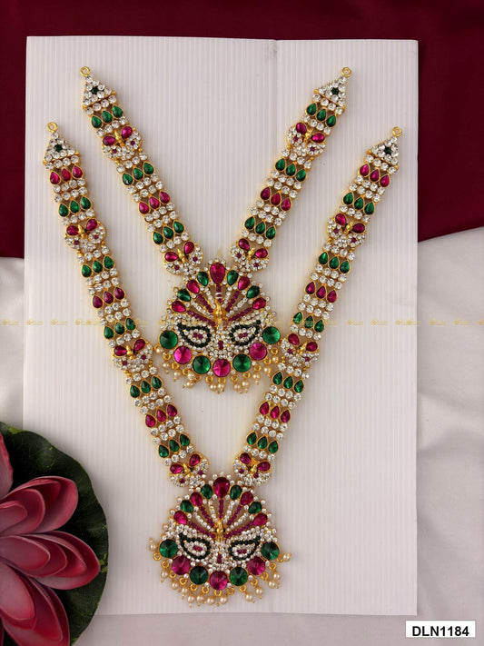 Front view of deity long haram set with multicolor stones and gold plating for idol alankaram