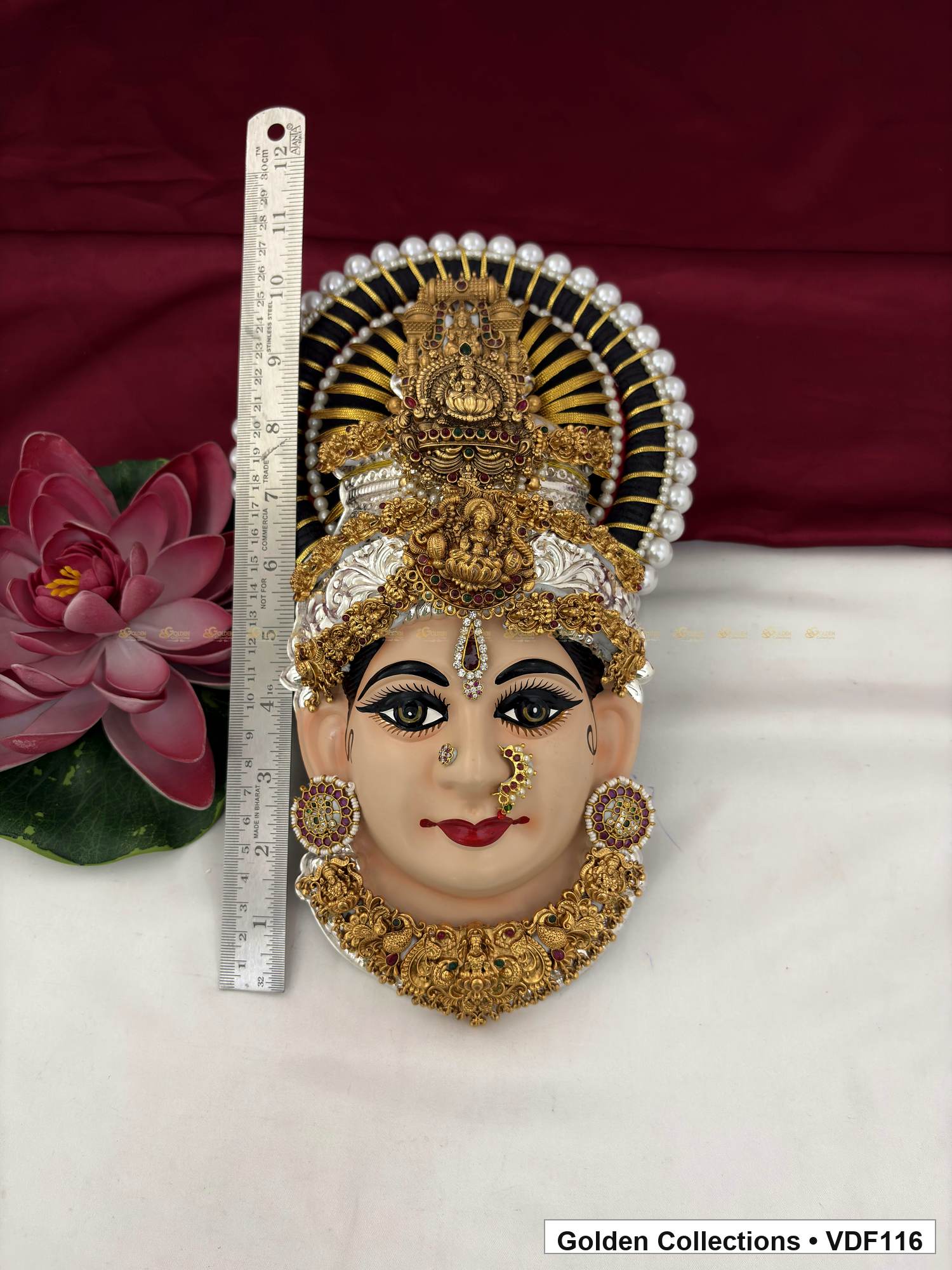 Measurement view of Varalakshmi Tanjore Face with Circular Medallion Crown and Scalloped Necklace with ruler beside the product