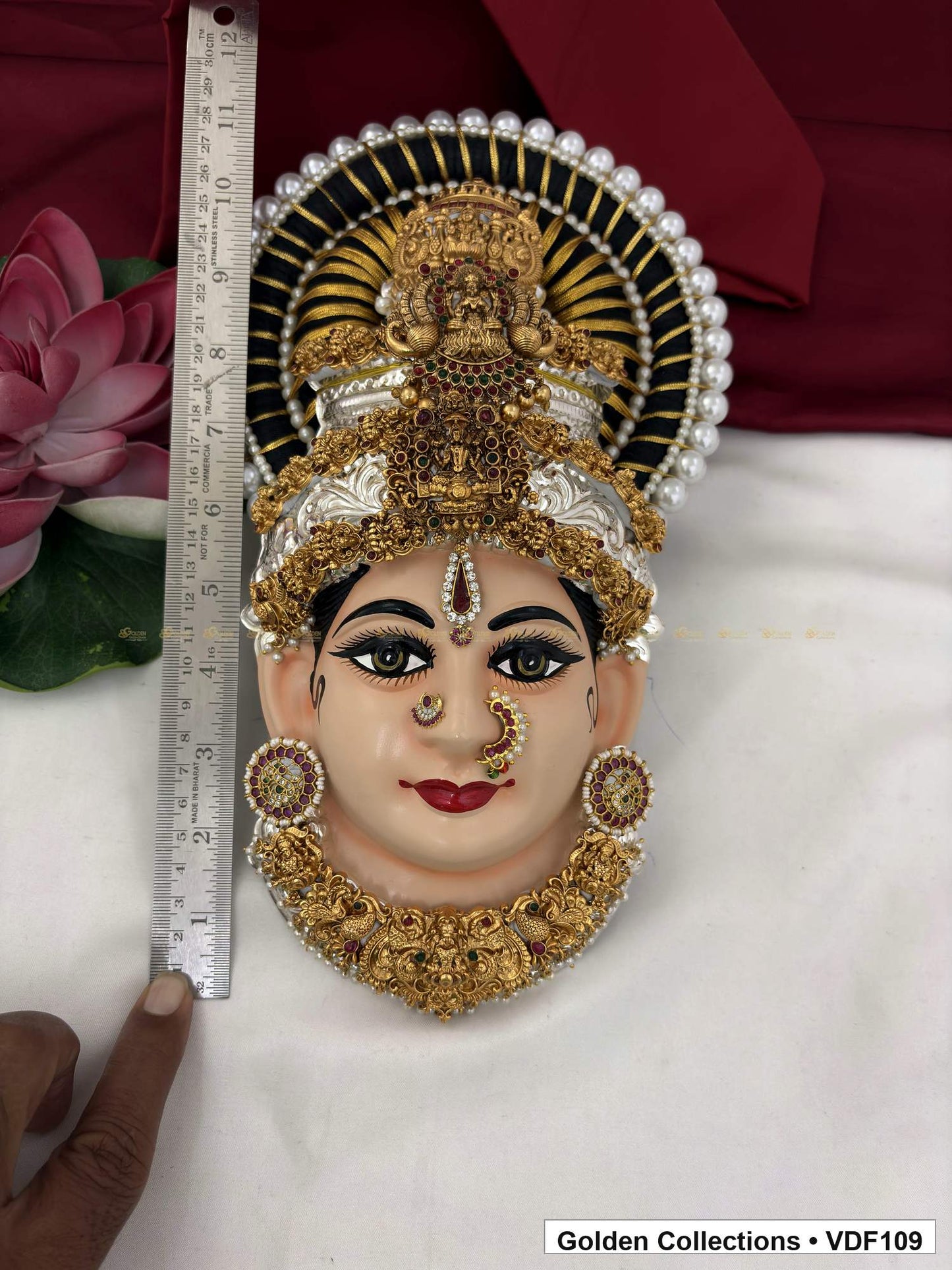 Measurement view of Varalakshmi Tanjore Face with Fan Halo Crown and Sculpted Collar Necklace with ruler beside the product