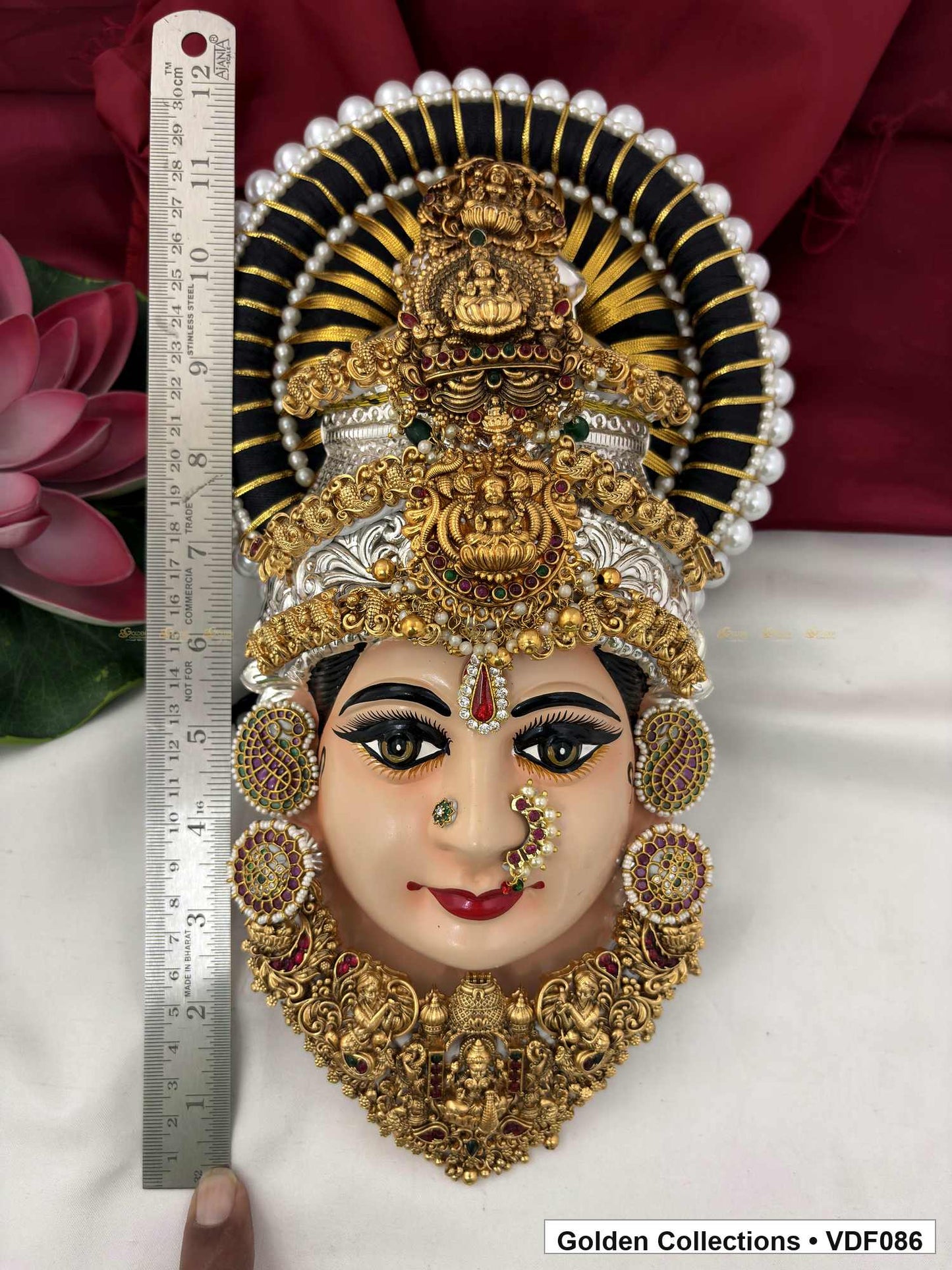 Measurement view of Varalakshmi Tanjore Face with Layered Figure-Motif Crown and Temple Necklace with ruler beside the product