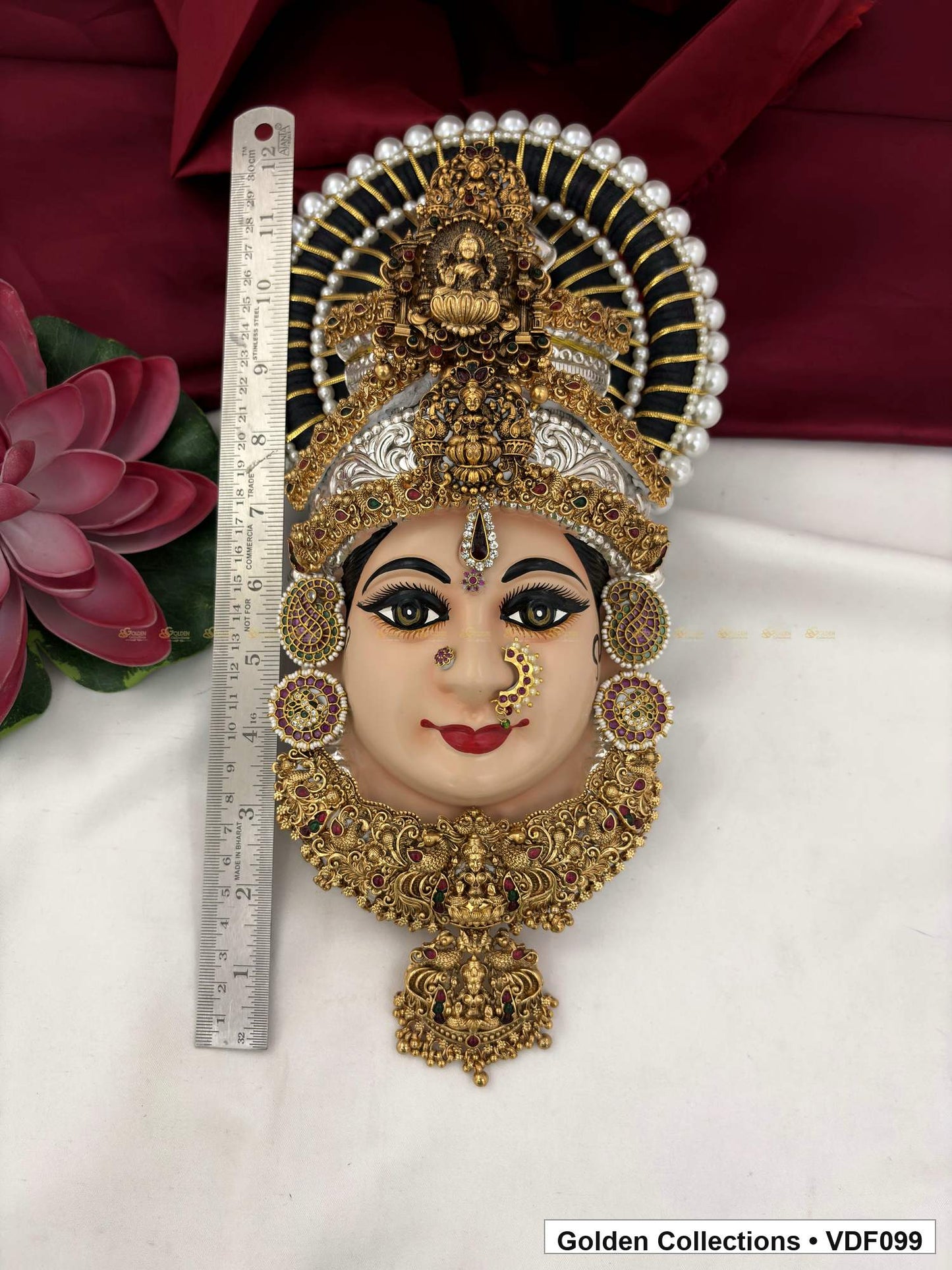 Varalakshmi Tanjore Face with Layered Motif Crown and Long Drop Pendant close-up detail view