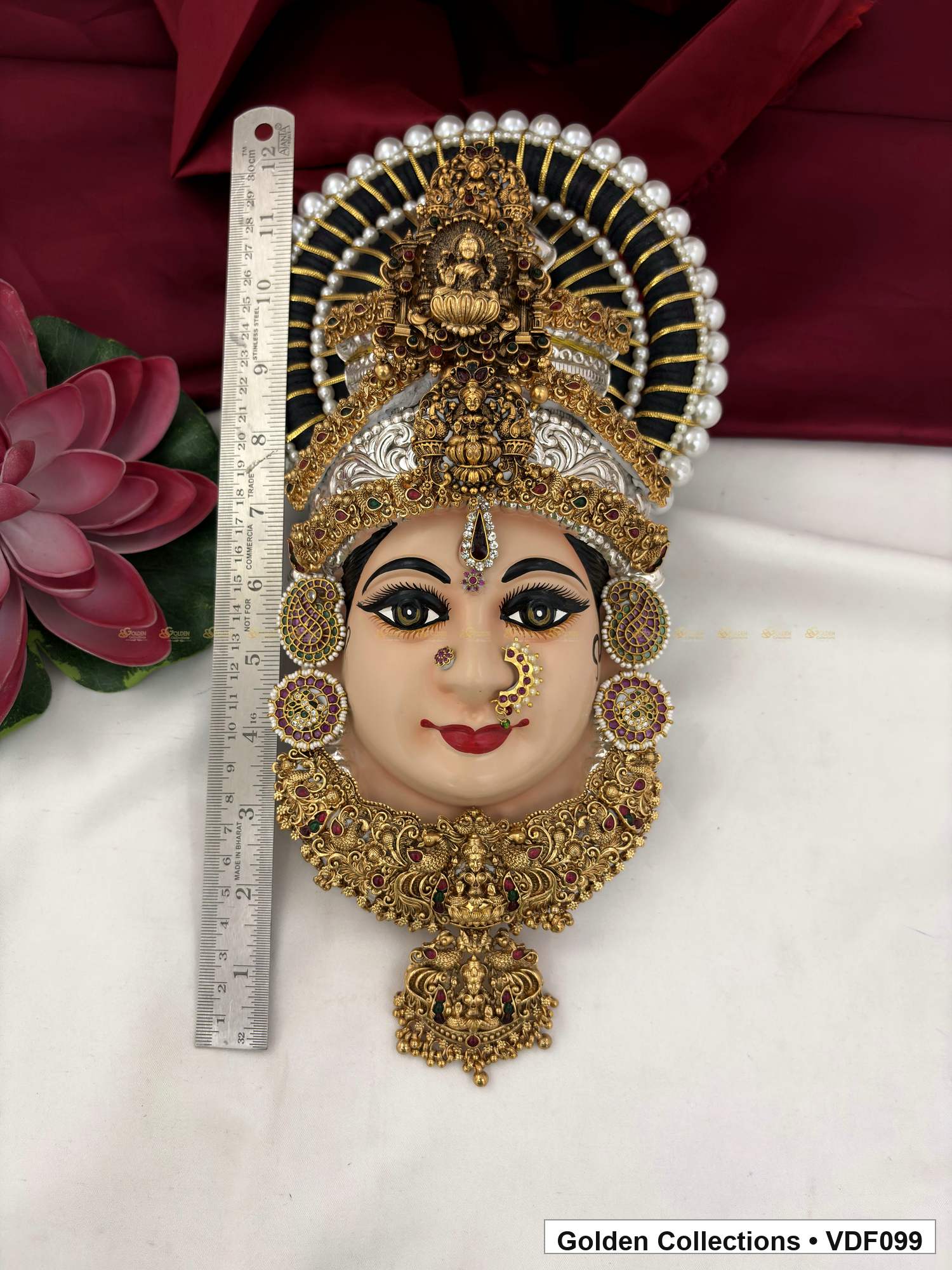 Varalakshmi Tanjore Face with Layered Motif Crown and Long Drop Pendant close-up detail view