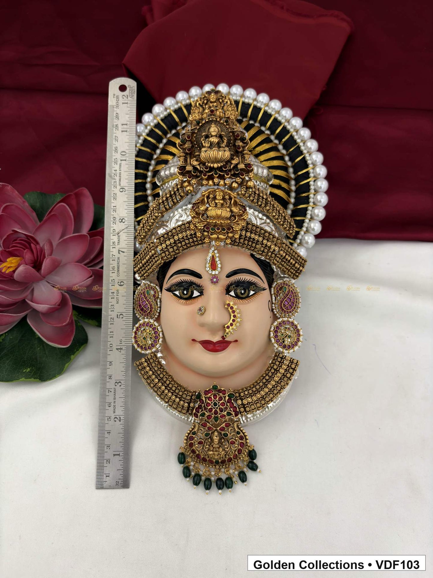 Varalakshmi Tanjore Face with Pearl-Halo Crown and Green Bead Pendant close-up detail view