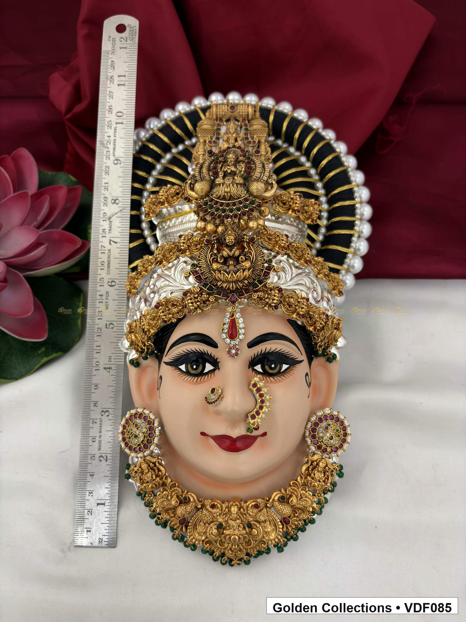 Varalakshmi Tanjore Face with Sculpted Double Crown and Green Fringe Necklace close-up detail view
