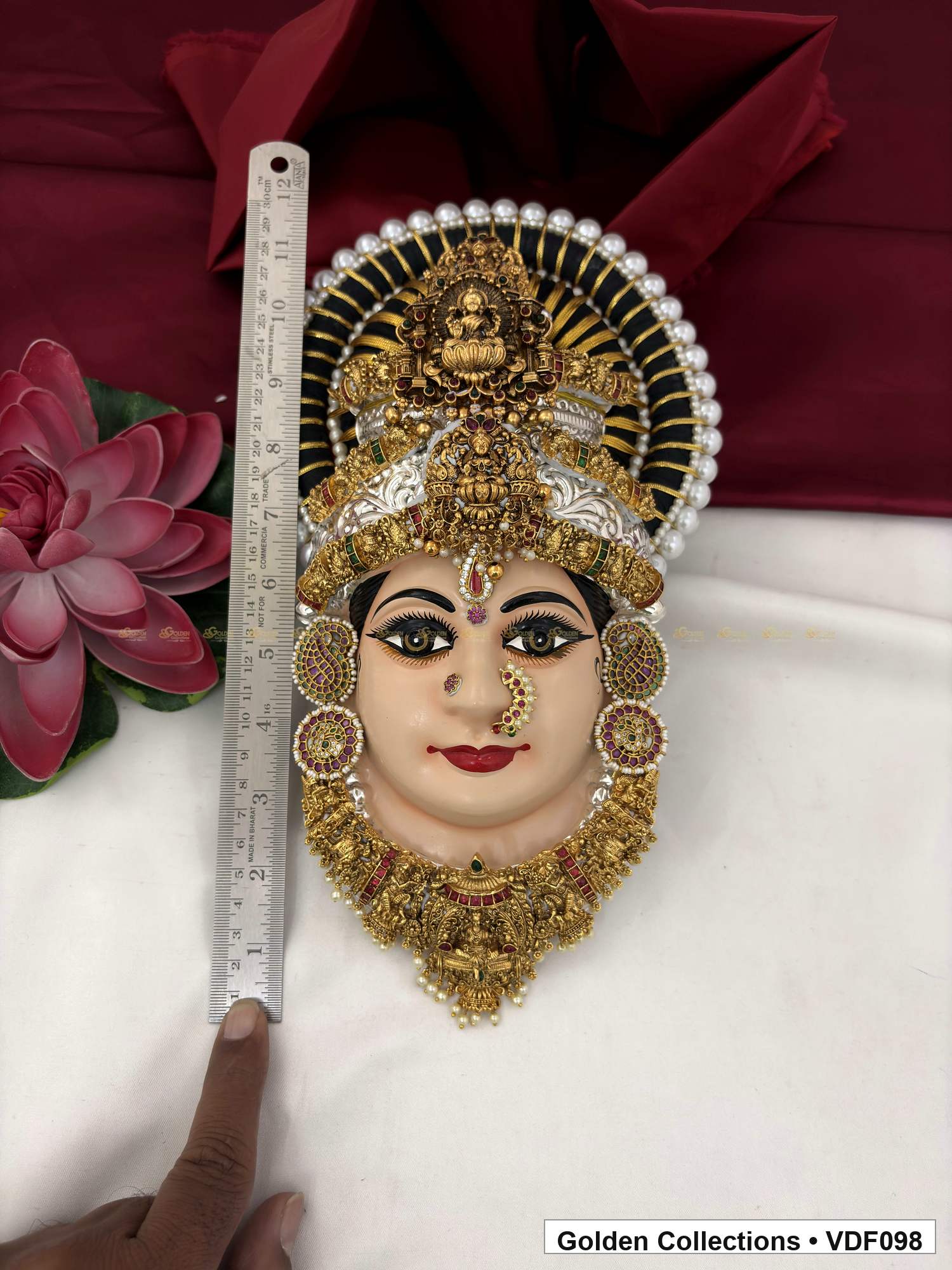 Varalakshmi Tanjore Face with Sculpted Figure Crown and Red-Green Necklace close-up detail view