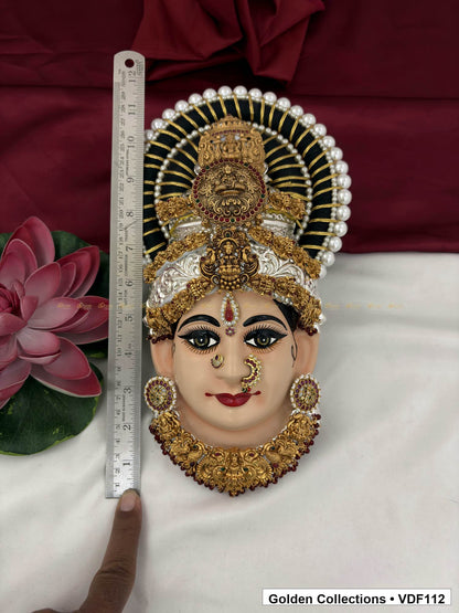 Measurement view of Varalakshmi Tanjore Face with Stacked Medallion Crown and Broad Sculpted Necklace with ruler beside the product