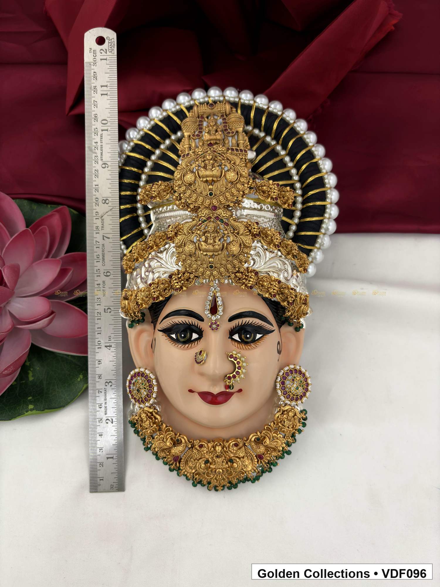 Varalakshmi Tanjore Face with Tall Rectangular Crown and Green Fringe Necklace close-up detail view