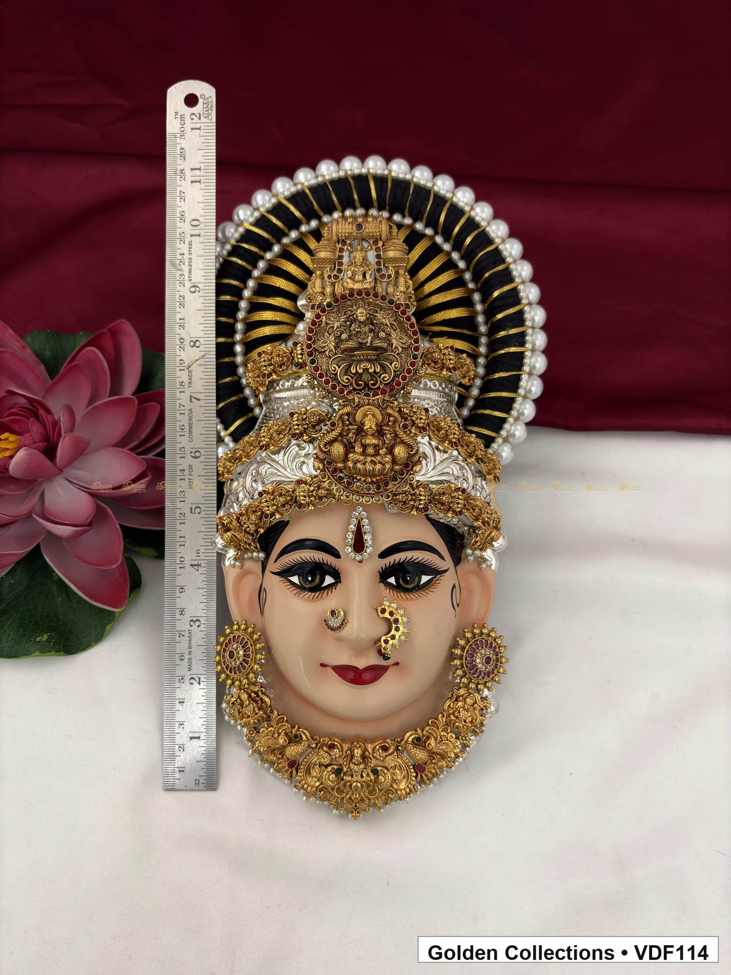 Measurement view of Varalakshmi Tanjore Face with Triple Motif Crown and Floral Collar Necklace with ruler beside the product