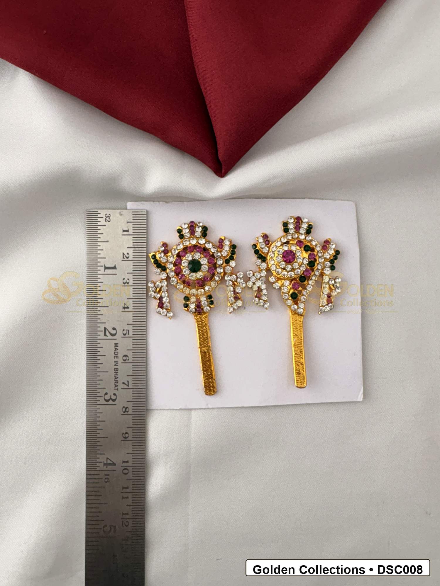 Measurement photo showing 2.5 x 1.25 Inches shanku chakra pair with ruler for Vishnu idol alankaram